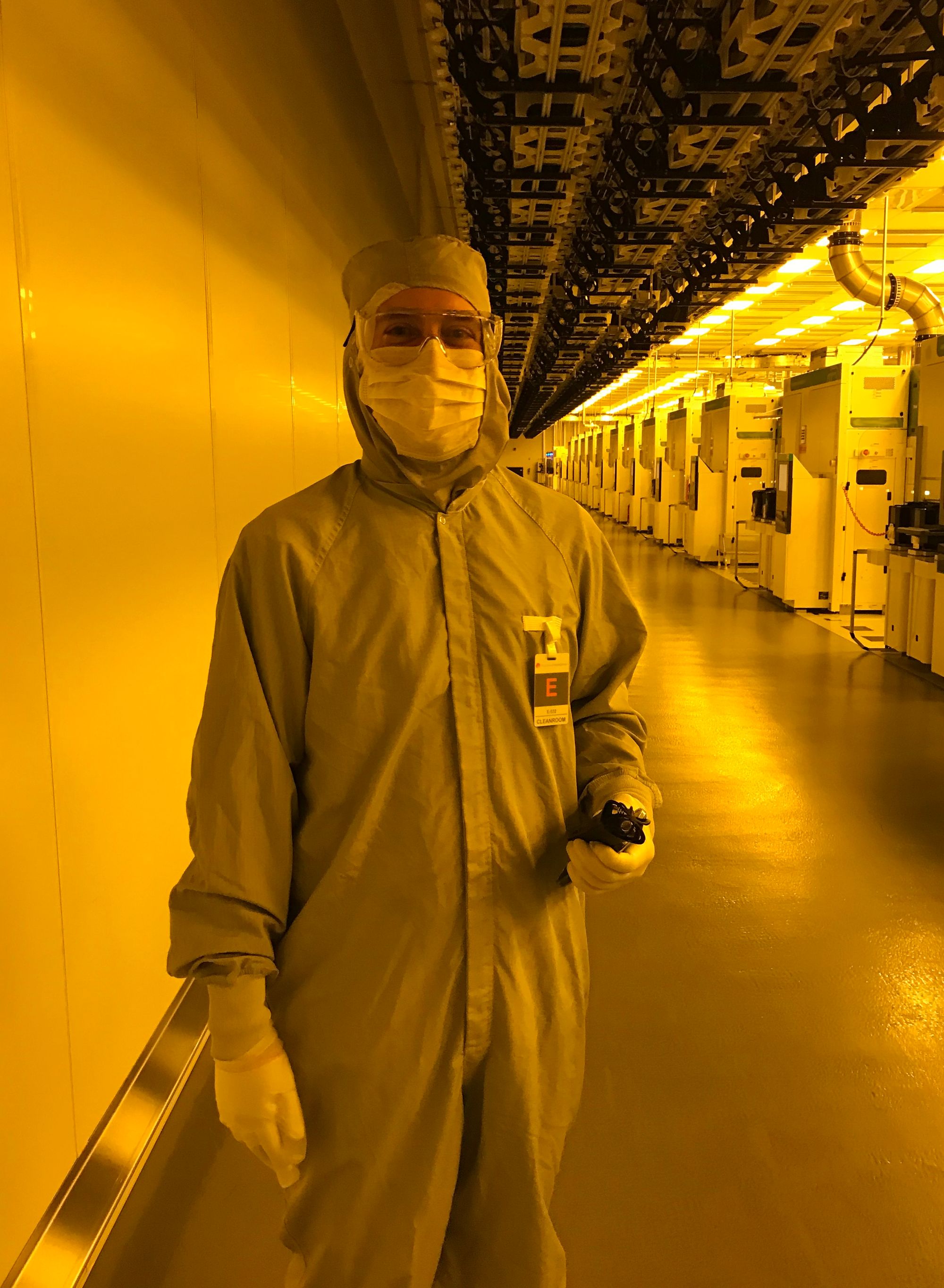 Blum in PPE inside the plant.