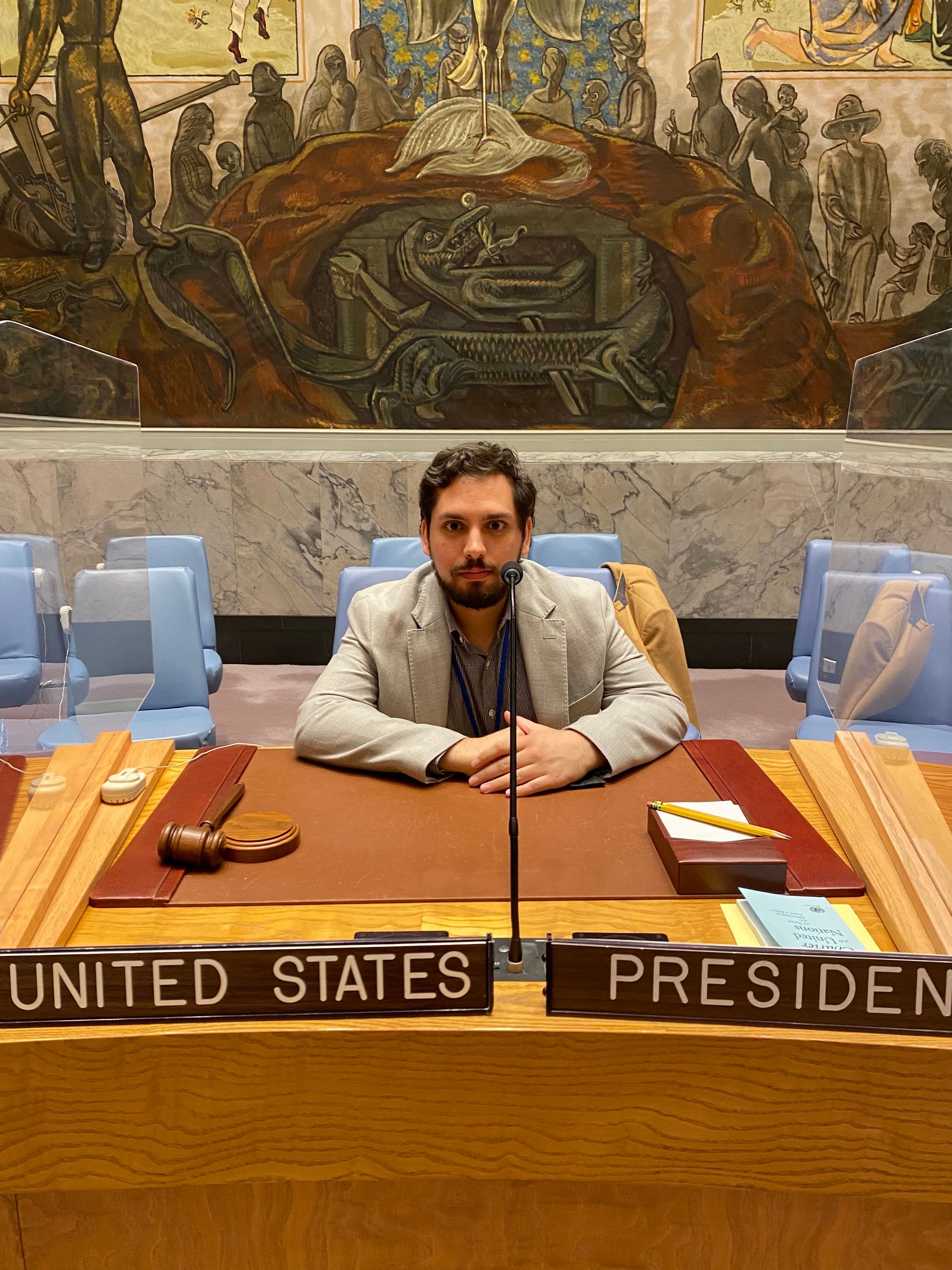 Pevsner sitting at a desk marked “United States President.”