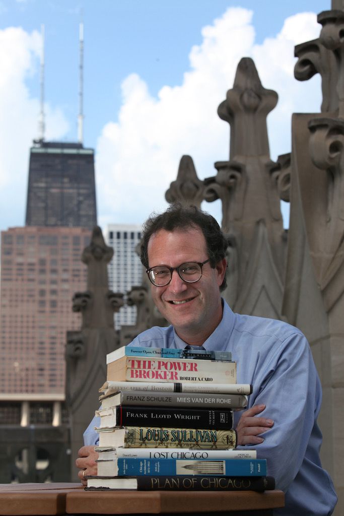 The books in Kamin’s stack include Robert Caro’s “The Power Broker,” Franz Schulze’s biography of Mies Van Der Rohe, and David Lowe’s “Lost Chicago.”